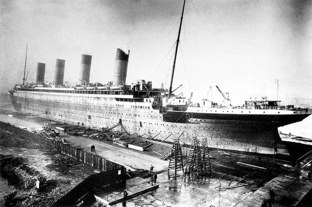 UK: RMS Titanic being fitted out at Harland and Wolf Shipyard, Belfast, 1911-1912 RMS Titanic was a British passenger liner that sank in the North Atlantic Ocean in the early morning of 15 April 1912, after colliding with an iceberg during her maiden voyage from Southampton to New York City.<br ><br > Of the 2,224 passengers and crew aboard, more than 1,500 died in the sinking, making it one of the deadliest commercial peacetime maritime disasters in modern history. The largest ship afloat at the time it entered service, the RMS Titanic was the second of three Olympic class ocean liners operated by the White Star Line, and was built by the Harland and Wolff shipyard in Belfast. Copyright: xxPicturesxFromxHistoryx