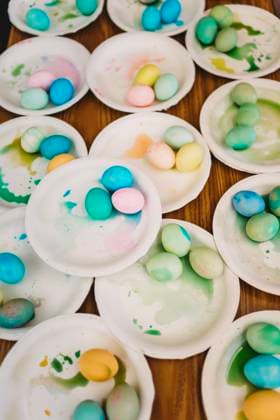 Overhead view of plates with colored Easter eggs Huntington Beach, California, United States R_RASI240402-1384101-01