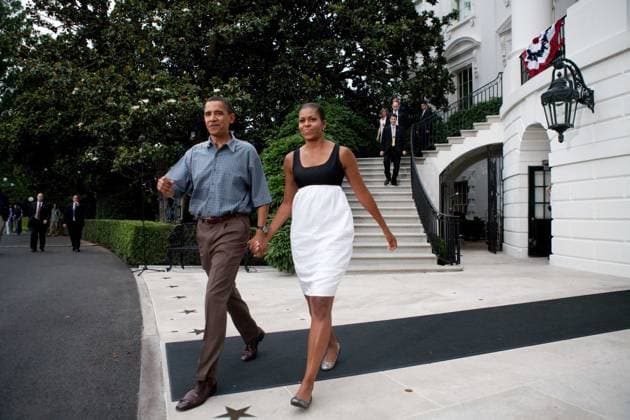 Obama1662.JPG.Washington, DC - July 4, 2009 -- United States President Barack Obama and First Lady Michelle Obama make their way from White House to shake hands with guests at a gathering of military families at the White House on July 4, 2009 in Washington, DC. President Obama is leaving tomorrow on a trip to Russia, Italy, and Ghana. .Digital Photo by Brendan Hoffman POOL-CNP-PHOTOlink. Washington DC USA EDITORIAL USE ONLY Copyright: xx BrendanxHoffman POOL-CNP-PHOTOlix phlphotos245953
