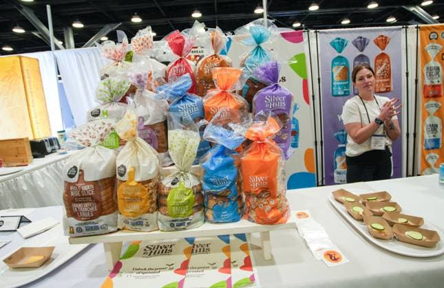 (240405) -- VANCOUVER, April 5, 2024 -- An exhibitor displays bakery products during the 2024 CHFA NOW trade show in Vancouver, British Columbia, Canada, on April 5, 2024. Over 900 exhibitors from across the world showcased their latest natural, organic and wellness products at the CHFA NOW, a health food trade show hosted by Canadian Health Food Association (CHFA). (Photo by Xinhua) CANADA-VANCOUVER-CHFA NOW-TRADE SHOW LiangxSen 