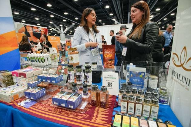 (240405) -- VANCOUVER, April 5, 2024 -- People talk by a stand during the 2024 CHFA NOW trade show in Vancouver, British Columbia, Canada, on April 5, 2024. Over 900 exhibitors from across the world showcased their latest natural, organic and wellness products at the CHFA NOW, a health food trade show hosted by Canadian Health Food Association (CHFA). (Photo by Xinhua) CANADA-VANCOUVER-CHFA NOW-TRADE SHOW LiangxSen 
