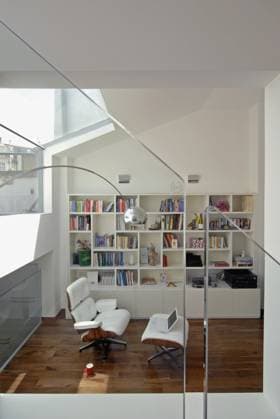 View through glass panels to contemporary sitting room with white leather Eames chair and ottoman View through glass panels to contemporary sitting room with white leather Eames chair and ottoman, Credit:Mark York Avalon  Copyright: xMarkxYorkx xAvalonx 0544848277