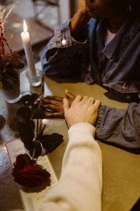 High angle view of multiracial couple holding hands during candlelight date at bar Germany, Berlin, model released, property released Copyright: xMaskotx , MA108404 MA108404