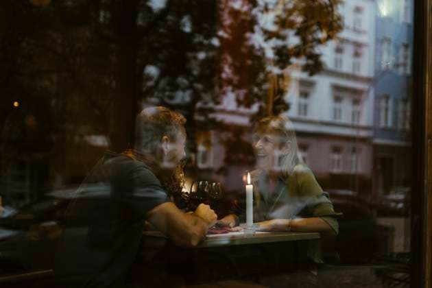 Happy mature couple having fun during date at restaurant seen through glass Germany, Berlin, model released, property released Copyright: xMaskotx , MA108428 MA108428