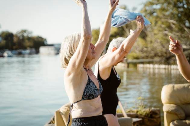 Carefree senior female friends dancing during vacation on houseboat Germany, Berlin, model released, property released Copyright: xMaskotx , MA108715 MA108715