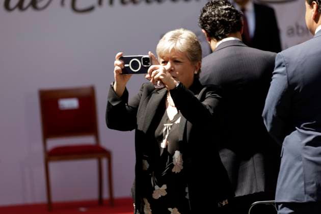 April 10, 2024 in Mexico City, Mexico: Foreign Affairs, Minister Alicia Barcena takes photos during the ceremony for the 105th Death Anniversary of Emiliano Zapata, held in the Patio of Honor of the National Palace. Mexico City Mexico - ZUMAe321 20240410_zia_e321_033 Copyright: xLuisxBarronx