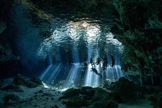 Scuba Diving In World Famous Cenotes In Tulum - Mexico Scuba divers inside the world famous Cenote Dos Ojos near Tulum, Mexico on February 2024. A cenote is a natural sinkhole filled with fresh water. The term originated on the Yucatan Peninsula of Mexico, where the ancient Maya commonly used cenotes for water supplies, and occasionally for sacrificial offerings. Photo by Christophe Geyres ABACAPRESS.COM Tulum Mexico  Copyright: xGeyresxChristophe ABACAx