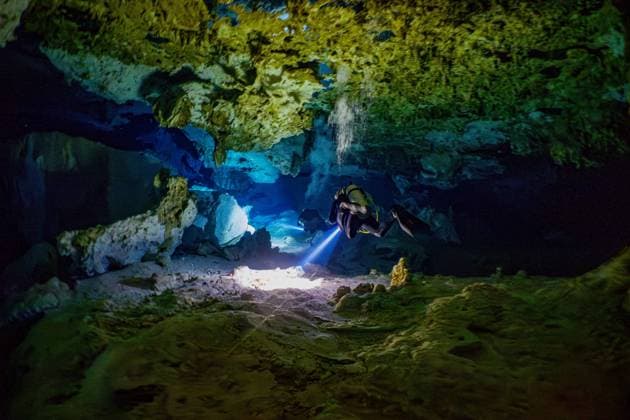 Scuba Diving In World Famous Cenotes In Tulum - Mexico Scuba divers inside the world famous Cenote Dos Ojos near Tulum, Mexico on February 2024. A cenote is a natural sinkhole filled with fresh water. The term originated on the Yucatan Peninsula of Mexico, where the ancient Maya commonly used cenotes for water supplies, and occasionally for sacrificial offerings. Photo by Christophe Geyres ABACAPRESS.COM Tulum Mexico  Copyright: xGeyresxChristophe ABACAx