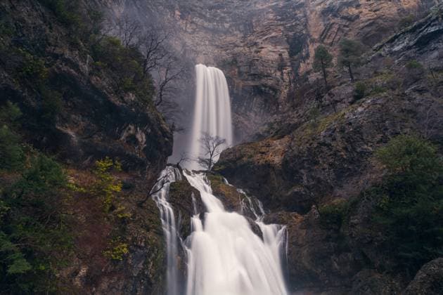 Creative Highlights World MR_ID21195_17156_IrenePerez.jpg, MR_ID21195_17157_JavierMartinez.jpg The powerful Rio Mundo burst from its source, creating a stunning multi-tiered waterfall set against a rocky landscape Model Released JavierMartinez_ID21195_624900_021 Copyright: xJavierxMartinezx