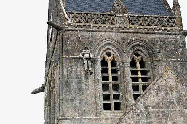 Illustration - Church Of Sainte-Mere-Eglise This photograph taken on April 25, 2024, shows the church of Sainte-Mere-Eglise, northwestern France, where a dummy depicting a paratrooper is hanging. An American paratrooper - John Marvin Steele 1912-1969 - landed on the pinnacle of the church tower in Sainte-Mere-Eglise, first village to be liberated by the United States Army during Operation Overlord on June 6, 1944. In June, France will hold a ceremony to mark the 80th anniversary of the 1944 Normandy landings also known as the D-Day landings along the Normandy beaches, an operation that laid the foundations of the Allied victory on the Western Front. Photo by Franck Castel ABACAPRESS.COM Sainte-Mere-Eglise France  Copyright: xCastelxFranck ABACAx