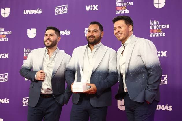 (L-R) David Castro, Alan Ramirez and Oswaldo Silvas of Banda MS, winners of the Latin AMA Legacy award, poses in the press room during the 2024 Latin American Music Awards at the Grand Garden Arena at MGM Resort and Casino in Las Vegas, Nevada on Thursday, April 25, 2024.  LAV20240425181 JAMESxATOA