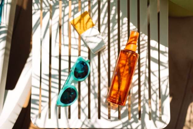 Sunscreens, sunglasses and a delicious chilled cocktail on the pool table Sunscreens, sunglasses and a delicious chilled cocktail on the pool table. Mock-ups of cosmetics and lemonade next to the chaise longue. A delicious cooling drink on vacation at the hotel. Copyright: xZoonar.com DashaxPetrenkox 21476375