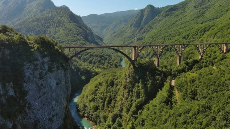 Aerial view on Djurdjevica arch bridge over Tara Aerial view on Djurdjevica arch bridge over the Tara River in northern Montenegro Copyright: xZoonar.com MikhailxKokhanchikovx 21481932