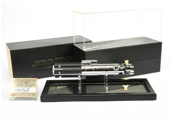 Star Wars toys and memorabilia fetches a whopping Â£145K at auction, in Teesside Story from Jam Press (Star Wars Auction) Pictured: Luke Skywalker lightsaber. Star Wars toys and memorabilia fetches a whopping Â£145K at auction, in Teesside Star Wars toys and memorabilia including a Luke Skywalker action figure and signed lightsaber from Mark Hamil fetch a total of Â£145K at auction. The Luke Skywalker figure was sold for an astonishing Â£6,125, as reported by What™s The Jam. Sealed in its original packaging from 1980, the figure is equipped with a lightsaber accessory. The Luke Skywalker figure is based on Mark Hamill™s portrayal of the character in the second of the original trilogy, The Empire Strikes Back. A Gamorrean guard f  Copyright: xJamxPress xVectisxAuctions