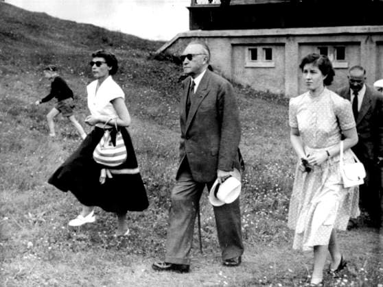 The Man At Muerren: Dr. Konrad Adenauer, the Federal Chancellor, takes the air at Muerren, Switzerland, July 20, with his daughter, Dr. Ria Reiners, left, and an unnamed woman secretary. He arrived at Muerren - only 87 miles from Geneva - July 18, the day the big four talks began. He is on a holiday. July 21, 1955. (Photo by Associated Press Photo) Geneva Switzerland  Copyright: xAssociatedxPressxPhotox 5513-35479954