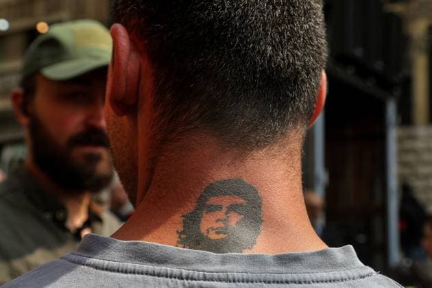 May 1, 2024, Beirut, Beirut, Lebanon: A supporter of the Lebanese Communist Party, sporting a tattoo of Che Guevara portrait on his neck, takes part in a demonstration in Beirut to mark the International Labor Day. Hundreds of Lebanese workers took part in the protest to express their disapproval and anger over the worsening socio-economic situation and to show their support to Palestinians and condemnation to Israel. Beirut Lebanon - ZUMAn313 20240501_zip_n313_006 Copyright: xMarwanxNaamanix