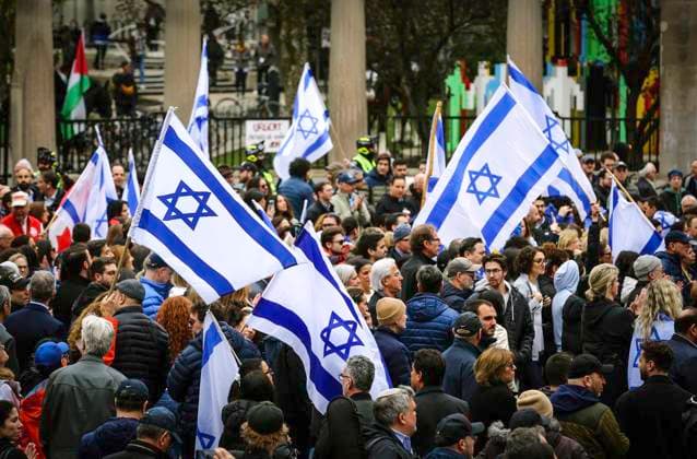 May 2, 2024, Montreal, Quebec, Canada: On Day 6 of McGill encampment, pro-Palestinian and pro-Israel protesters face off. Police in riot gear have lined up at campus entrance, keeping both groups separate. Montreal Canada - ZUMAs278 20240502_zip_s278_001 Copyright: xSerkanxSenturkx