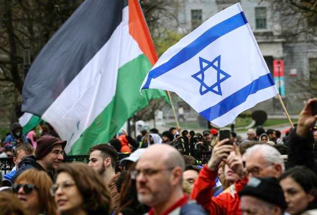 May 2, 2024, Montreal, Quebec, Canada: On Day 6 of McGill encampment, pro-Palestinian and pro-Israel protesters face off. Police in riot gear have lined up at campus entrance, keeping both groups separate. Montreal Canada - ZUMAs278 20240502_zip_s278_005 Copyright: xSerkanxSenturkx