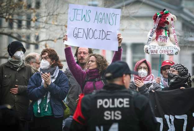 May 2, 2024, Montreal, Quebec, Canada: On Day 6 of McGill encampment, pro-Palestinian and pro-Israel protesters face off. Police in riot gear have lined up at campus entrance, keeping both groups separate. Montreal Canada - ZUMAs278 20240502_zip_s278_004 Copyright: xSerkanxSenturkx