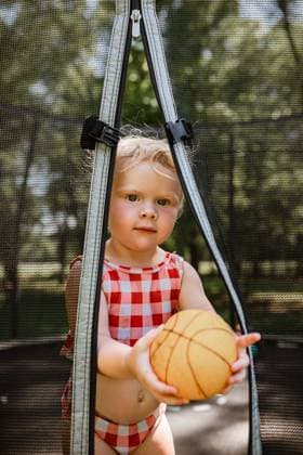 Creative Highlights Symbolbilder Toddler with basketball on trampoline McClure, Illinois, United States CR_WEKW240429C-1417833-01 ,model released, Symbolfoto