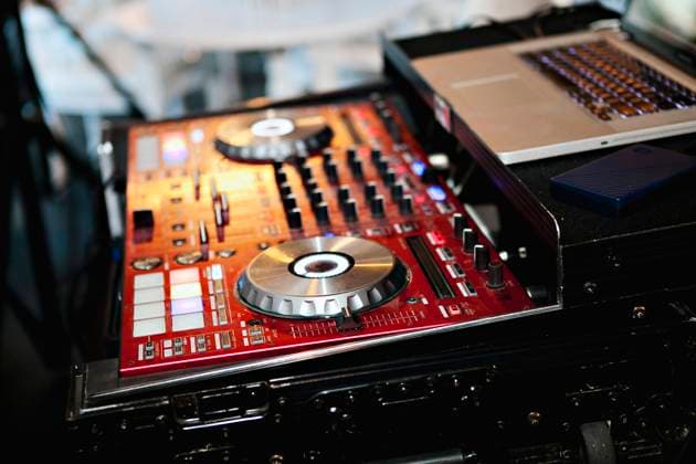 Sleek DJ mixer with glowing lights ready for music mixing. Palm Springs, California, United States R_XPKR240426G-1413049-01