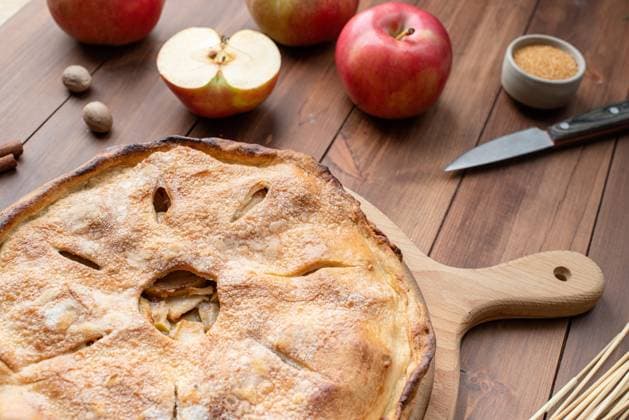 Homemade apple pie with fresh red apples Autumn food. Homemade apple pie with fresh red apples on wooden table Copyright: xILONAxSHOROKHOVA