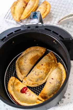 Sweet Cherry Empanadas in Air Fryer Frying sweet cherry empanadas in the air fryer. Copyright: xArinaxHabich RECORD DATE NOT STATED