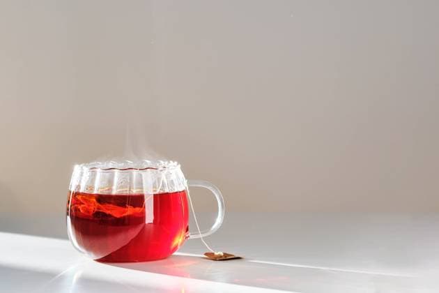 Glass mug with hot black tea on the table. Glass mug with hot black tea on the table. High quality photo. Copyright: xZoonar.com MAREVGENNAx 21611699