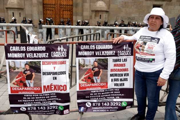 A mother of a missing person holds a placard whit a photo of her loved one as takes part during a protest on Mother s Day to demand that the government clarify the disappearances in front of the National Palace at Zocalo Square. Mexico City Mexico - ZUMAe321 20240510_zia_e321_014 Copyright: xLuisxBarronx