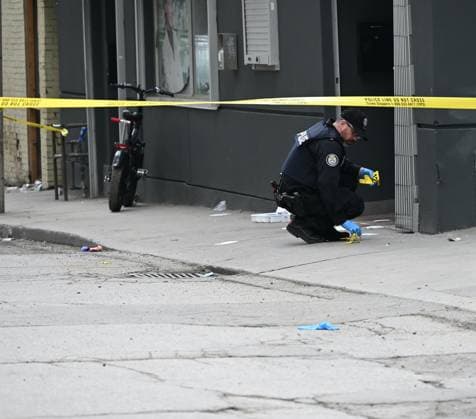 50-Year-Old Jamie Richardson Dies In Slashing Attack In Toronto, Canada - 12 May 2024 Police officer places evidence markers at the scene of a slashing attack where evidence and blood were located on the ground. Police are currently seeking a suspect after 50-year-old Jamie Richardson was found with serious injuries and later died at the hospital following a slashing attack in Toronto. At approximately 10:24 a.m. on Sunday morning, police responded to the area of Dalhousie St and Shuter St, where officers found Jamie Richardson with serious injuries. Richardson was pronounced dead at the hospital. The police are describing the assault as a slashing and are searching for a suspect who is described as a male, black, 6 0 , with a large buil Copyright: xKylexMazzax xSOPAxImagesx KMZ_7091