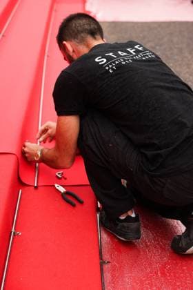 Cannes Red Carpet Roll Out DB Staff members work on the red carpet roll out ahead of the 77th annual Cannes Film Festival held at the palais des Festivals on May 14, 2024 in Cannes, France. Photo by David Boyer ABACAPRESS.COM  Copyright: xBoyerxDavid ABACAx