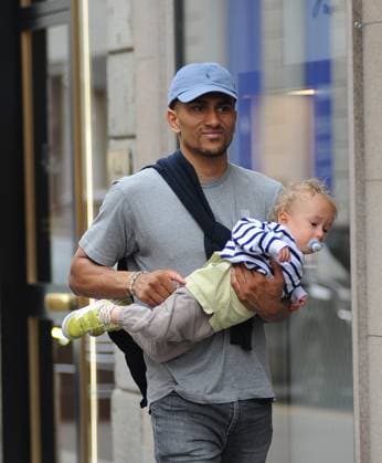 Milan, 14-05-2024 Maodo Lo, German basketball player who was world champion in 2023 in China with the GERMAN national team and now with Armani, walks through the streets of the center together with his girlfriend and son.  Copyright: xMimmoxCarrierox xipa-agency.netx xMIMMOxCARRIERO-x IPA_Agency_IPA46053793