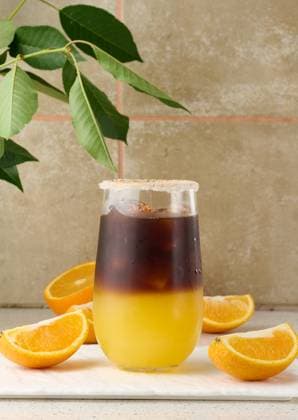 Cold coffee with orange juice in a transparent glass and orange slices Copyright: xDANKOxN RECORD DATE NOT STATED
