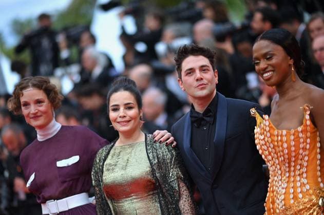 Cannes - Opening Ceremony Arrivals Asmae El Moudir, President of the Jury Xavier Dolan and MaÃ¯mouna Doucoure attends Le Deuxieme Acte The Second Act Screening opening ceremony red carpet at the 77th annual Cannes Film Festival at Palais des Festivals on May 14, 2024 in Cannes, France. Photo by Franck Castel ABACAPRESS.COM Cannes France  Copyright: xCastelxFranck ABACAx