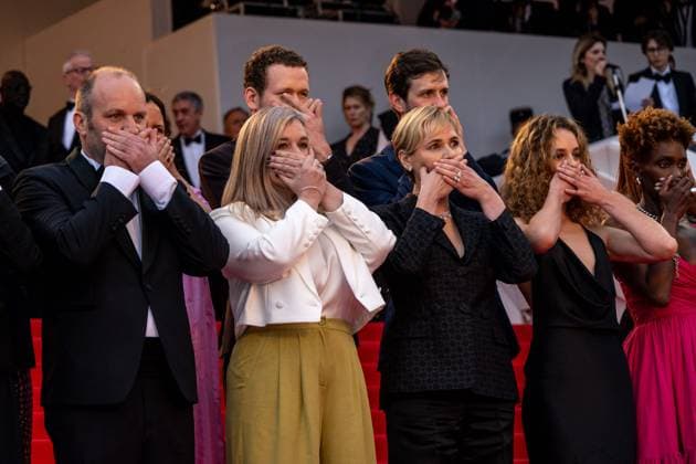Cannes - Judith Godreche Me Too Action at Screening of Mad Max Furiosa AAR Judith Godreche (center) and her daughter Tess Barthelemy (right) cover their mouth in a ?Me Too? in French cinema action, as they attend the screening of Mad Max ?Furiosa?, as part of 77th edition of Cannes Film Festival, in Cannes, France, on May 15, 2024. Photo by Ammar Abd Rabbo ABACAPRESS.COM Cannes France  Copyright: xAbdxRabboxAmmar ABACAx