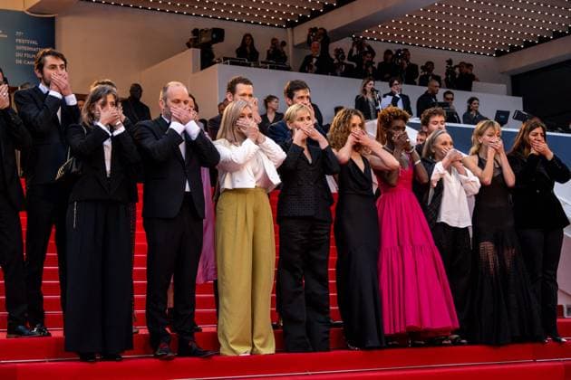 Cannes - Judith Godreche Me Too Action at Screening of Mad Max Furiosa AAR Judith Godreche (center) and her daughter Tess Barthelemy (right) cover their mouth in a ?Me Too? in French cinema action, as they attend the screening of Mad Max ?Furiosa?, as part of 77th edition of Cannes Film Festival, in Cannes, France, on May 15, 2024. Photo by Ammar Abd Rabbo ABACAPRESS.COM Cannes France  Copyright: xAbdxRabboxAmmar ABACAx