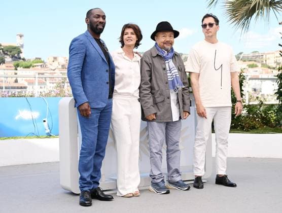 French actors Gregoire Colin, Cyril Guei, actress Irene Jacob and Cambodian director Rithy Pahn attend the photo call for Meeting With Pol Pot at the 77th Cannes Film Festival in Cannes, France on Friday, May 17, 2024.  CAN20240517141 RUNExHELLESTAD
