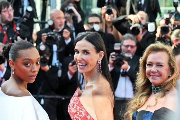 Cannes, 77th Cannes Film Festival 2024, Fourth Evening - red carpet of the film Kinds of Kindness - In the photo: Sophie Wilde, Demi Moore and Caroline Scheufele  Copyright: xManuelexMangiarottix xipa-agencyx xPoolxPhotoxEventsx03x IPA_Agency_IPA46184670