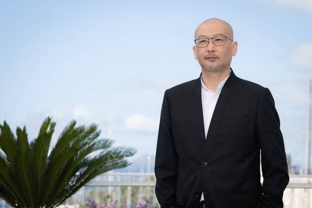 Cannes - Black Dog Photocall Guan Hu attends the Black Dog Photocall at the 77th annual Cannes Film Festival at Palais des Festivals on May 18, 2024 in Cannes, France. Photo by Shootpix ABACAPRESS.COM Cannes France  Copyright: xShootpix ABACAx
