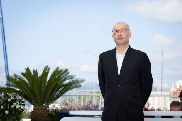 Cannes - Black Dog Photocall Guan Hu attends the Black Dog Photocall at the 77th annual Cannes Film Festival at Palais des Festivals on May 18, 2024 in Cannes, France. Photo by Shootpix ABACAPRESS.COM Cannes France  Copyright: xShootpix ABACAx