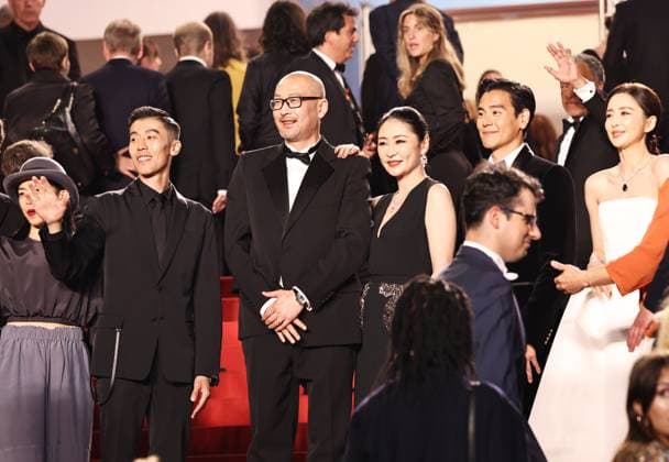 (240518) -- CANNES, May 18, 2024 -- Chinese director Guan Hu (3rd L) and cast members arrive at the red carpet for the film Gou Zhen (Black Dog) during the 77th edition of the Cannes Film Festival in Cannes, southern France, on May 17, 2024. The film Gou Zhen (Black Dog) is in competition for the category Un Certain Regard of the festival. ) FRANCE-CANNES-FILM FESTIVAL-BLACK DOG GaoxJing 