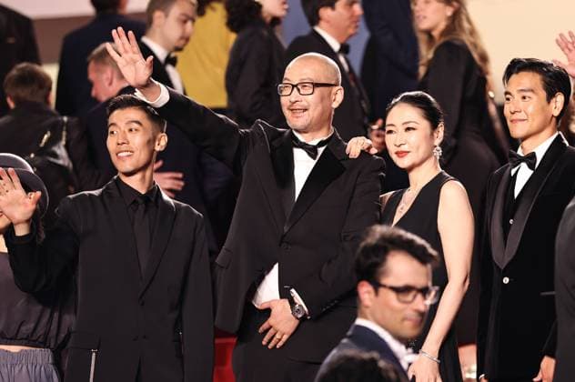 (240518) -- CANNES, May 18, 2024 -- Chinese director Guan Hu (C) and cast members Zhou You (1st L), Liang Jing (2nd R) and Eddie Peng arrive at the red carpet for the film Gou Zhen (Black Dog) during the 77th edition of the Cannes Film Festival in Cannes, southern France, on May 17, 2024. The film Gou Zhen (Black Dog) is in competition for the category Un Certain Regard of the festival. ) FRANCE-CANNES-FILM FESTIVAL-BLACK DOG GaoxJing 