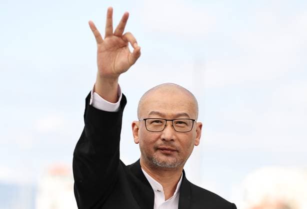 (240518) -- CANNES, May 18, 2024 -- Director Guan Hu poses during the photocall of the film Black Dog at the 77th edition of the Cannes Film Festival in Cannes, southern France, on May 18, 2024. ) FRANCE-CANNES-FILM FESTIVAL- BLACK DOG -PHOTOCALL GaoxJing 