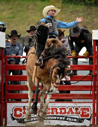 (240519) -- SURREY, May 19, 2024 -- A participant performs in the saddle bronc riding at the rodeo performance of the 76th annual Cloverdale Rodeo and Country Fair in Surrey, British Columbia, Canada, May 18, 2024. (Photo by Xinhua) (SP)CANADA-SURREY-CANADA-RODEO PERFORMANCE AndrewxSoong 