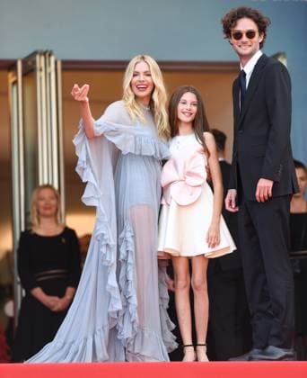 American actor Oli Green, British actress Sienna Miller and daughter Marlowe Sturridge attend the premiere of Horizon: An American Saga at the 77th Cannes Film Festival in Cannes, France on Sunday, May 19, 2024.  CAN20240519197 RUNExHELLESTAD