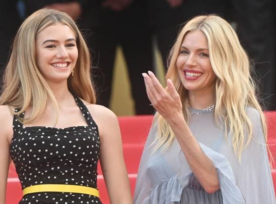 American actress Georgia Macphail and British actress Sienna Miller attend the premiere of Horizon: An American Saga at the 77th Cannes Film Festival in Cannes, France on Sunday, May 19, 2024.  CAN20240519185 RUNExHELLESTAD