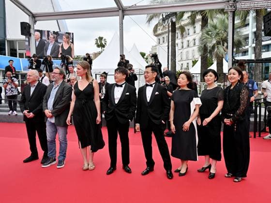 Cannes, 77th Cannes Film Festival 2024, Sixth evening - red carpet Palma d Or Studio Ghibli - In the photo: Vincent Maraval, Livia Van Der Staay, Kenichi Yoda, and Goro Miyazaki  Copyright: xManuelexMangiarottix xipa-agencyx xPoolxPhotoxEventsx03x IPA_Agency_IPA46310400