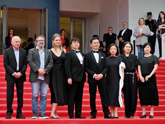 Cannes, France: Cannes, 77th Cannes Film Festival 2024, Sixth evening - red carpet Palma d Or Studio Ghibli - In the photo: Vincent Maraval, Livia Van Der Staay, Kenichi Yoda, and Goro Miyazaki Cannes France  - ZUMAp169 20240520_zea_p169_652 Copyright: xManuelexMangiarottix