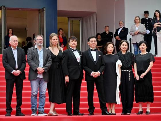 Cannes, France: Cannes, 77th Cannes Film Festival 2024, Sixth evening - red carpet Palma d Or Studio Ghibli - In the photo: Vincent Maraval, Livia Van Der Staay, Kenichi Yoda, and Goro Miyazaki Cannes France  - ZUMAp169 20240520_zea_p169_654 Copyright: xManuelexMangiarottix