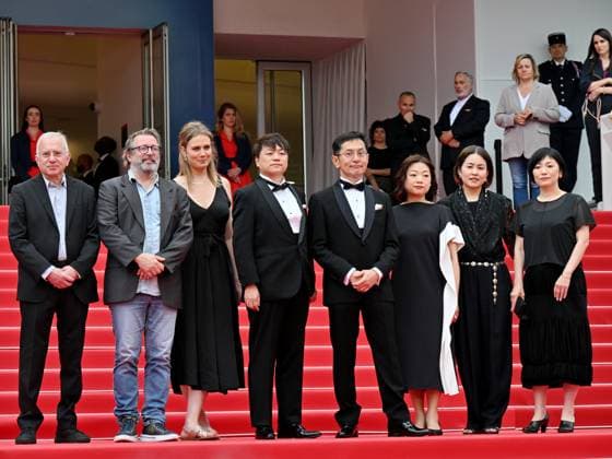 Cannes, France: Cannes, 77th Cannes Film Festival 2024, Sixth evening - red carpet Palma d Or Studio Ghibli - In the photo: Vincent Maraval, Livia Van Der Staay, Kenichi Yoda, and Goro Miyazaki Cannes France  - ZUMAp169 20240520_zea_p169_655 Copyright: xManuelexMangiarottix